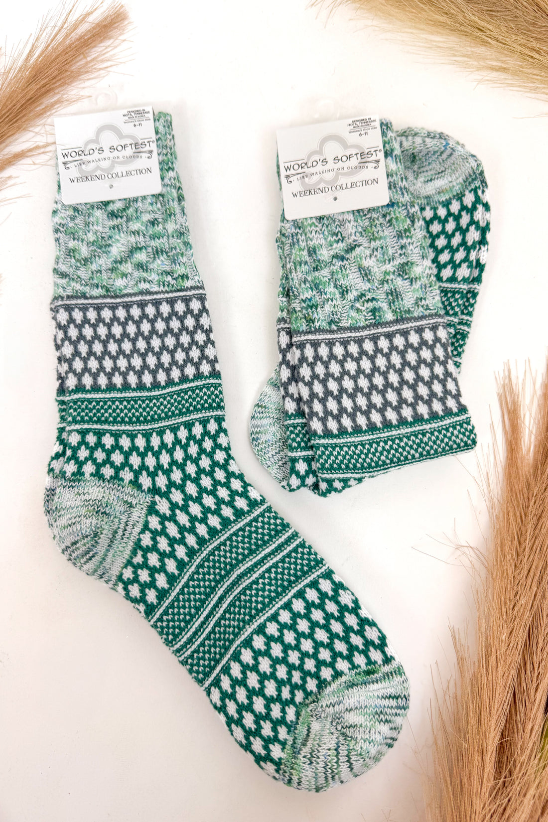 green and white patterned socks against a white background