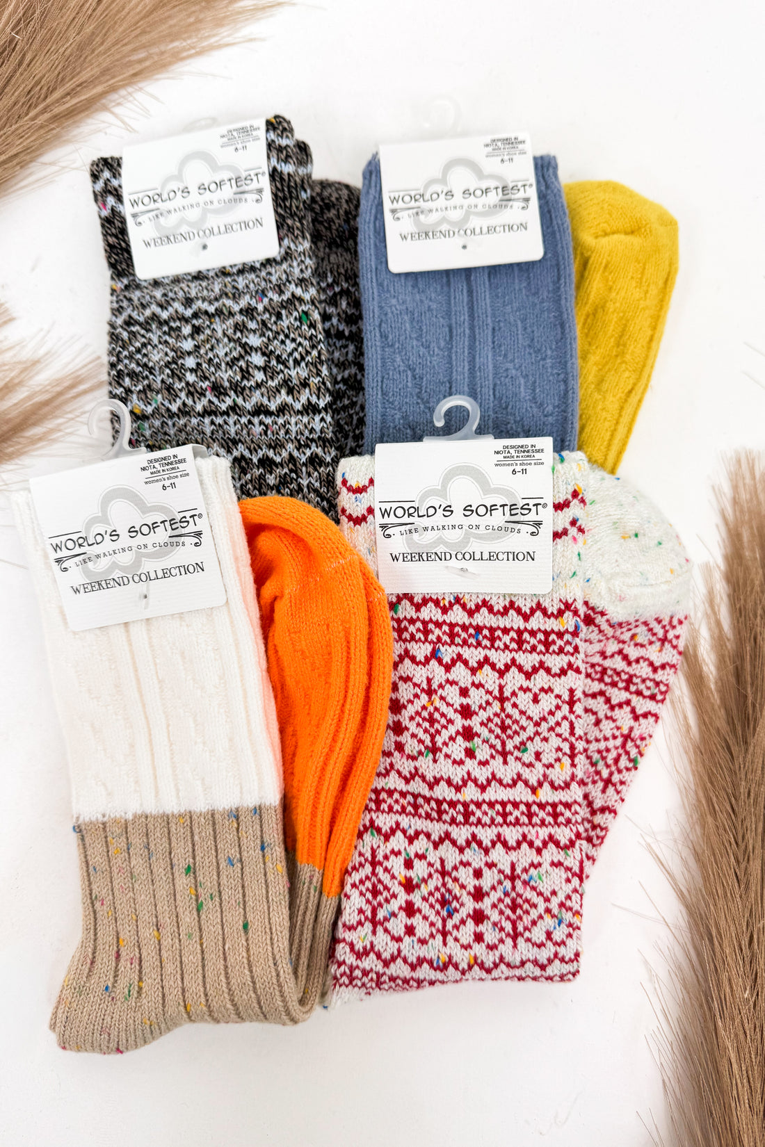 an array of colorful socks against a white background