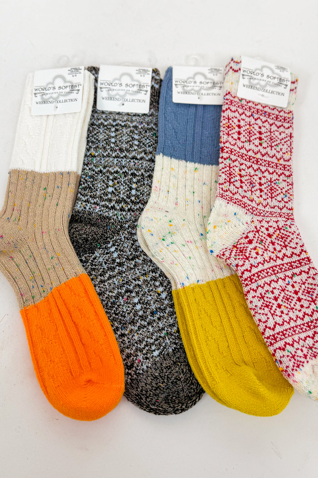 an array of colorful socks against a white background