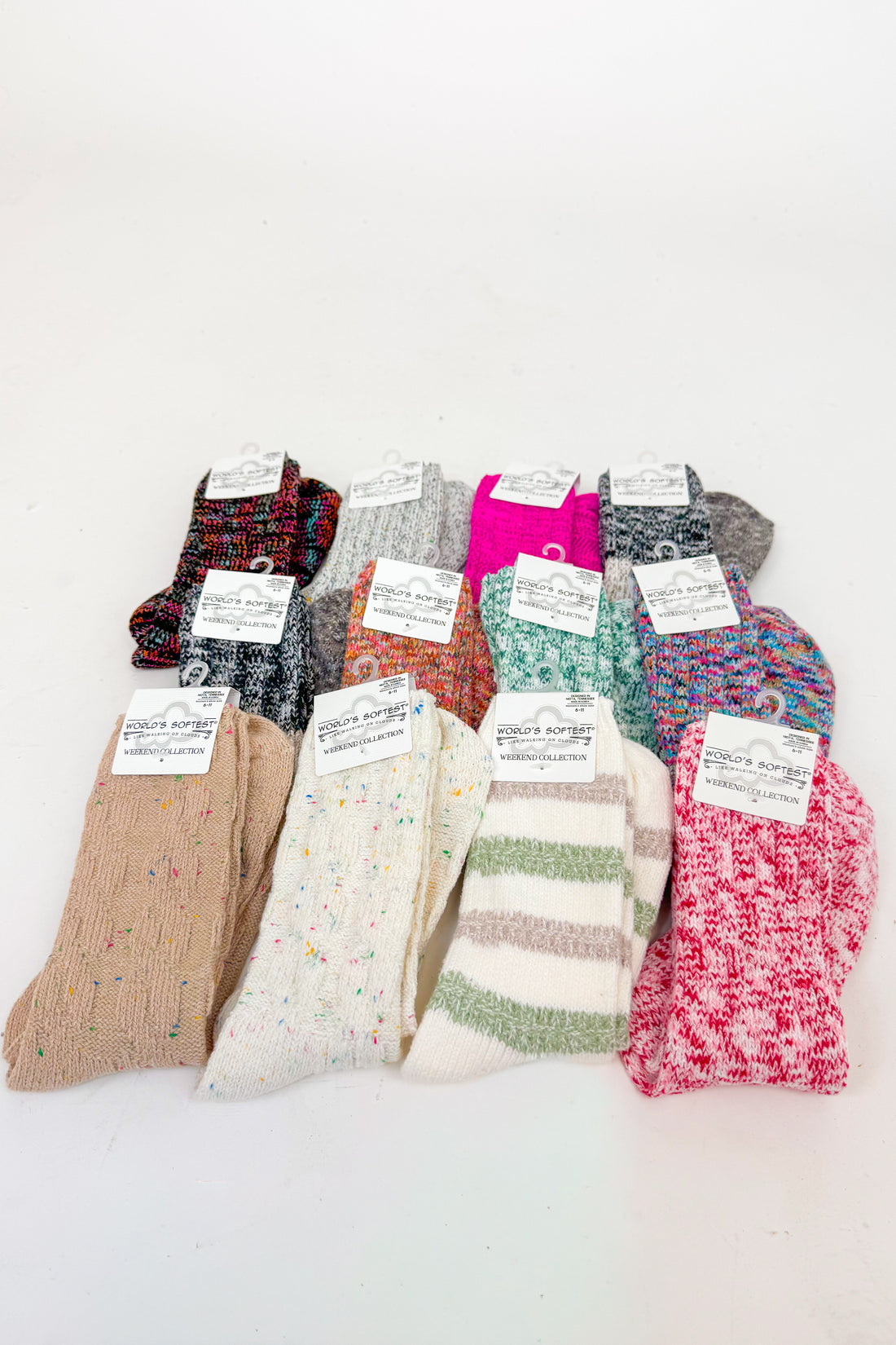 an array of colorful socks against a white background