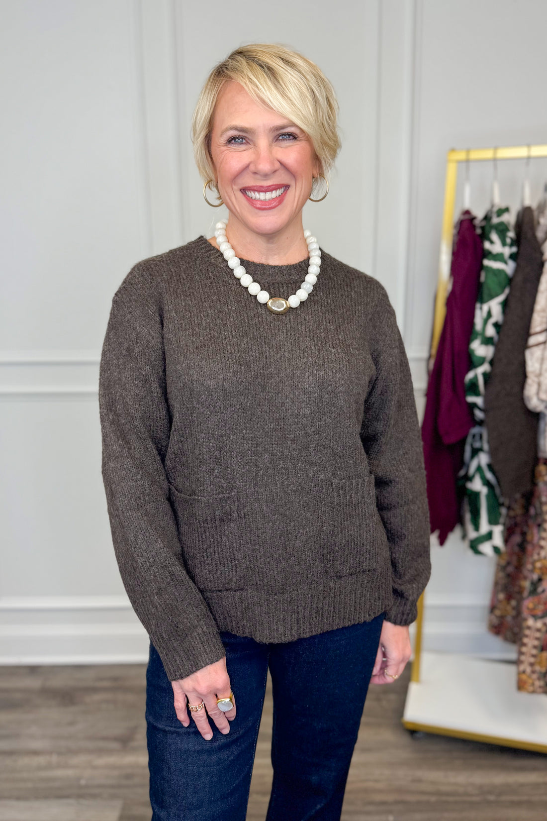 Front view of woman wearing Corks &amp; Cozy Brown Pocket Detail Sweater