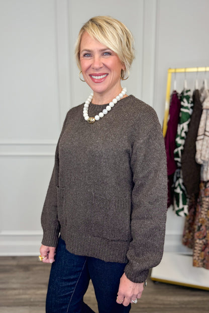 Side view of woman wearing Corks &amp; Cozy Brown Pocket Detail Sweater