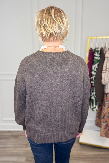 Rear view of woman wearing Corks &amp; Cozy Brown Pocket Detail Sweater
