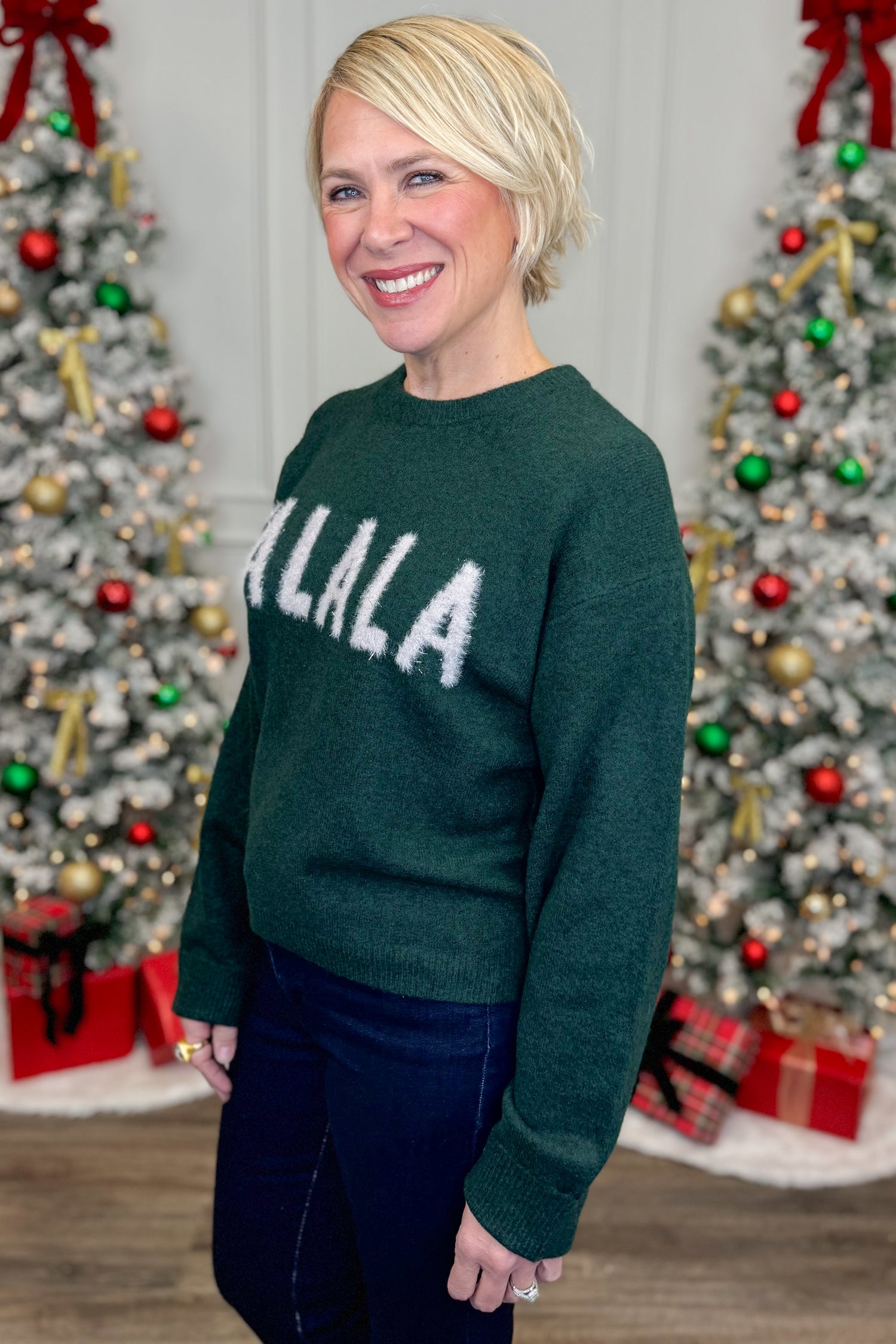 Person wearing a green sweater with &quot;FALALA&