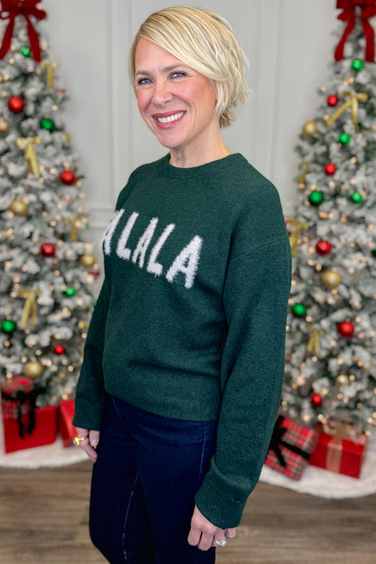 Person wearing a green sweater with &quot;FALALA&