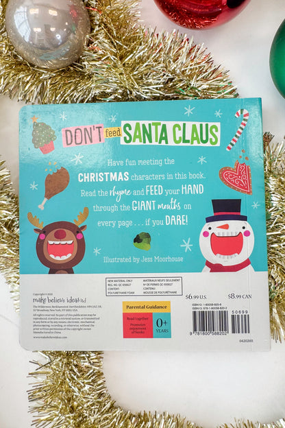 Book cover with a cartoon Santa Claus face and text &