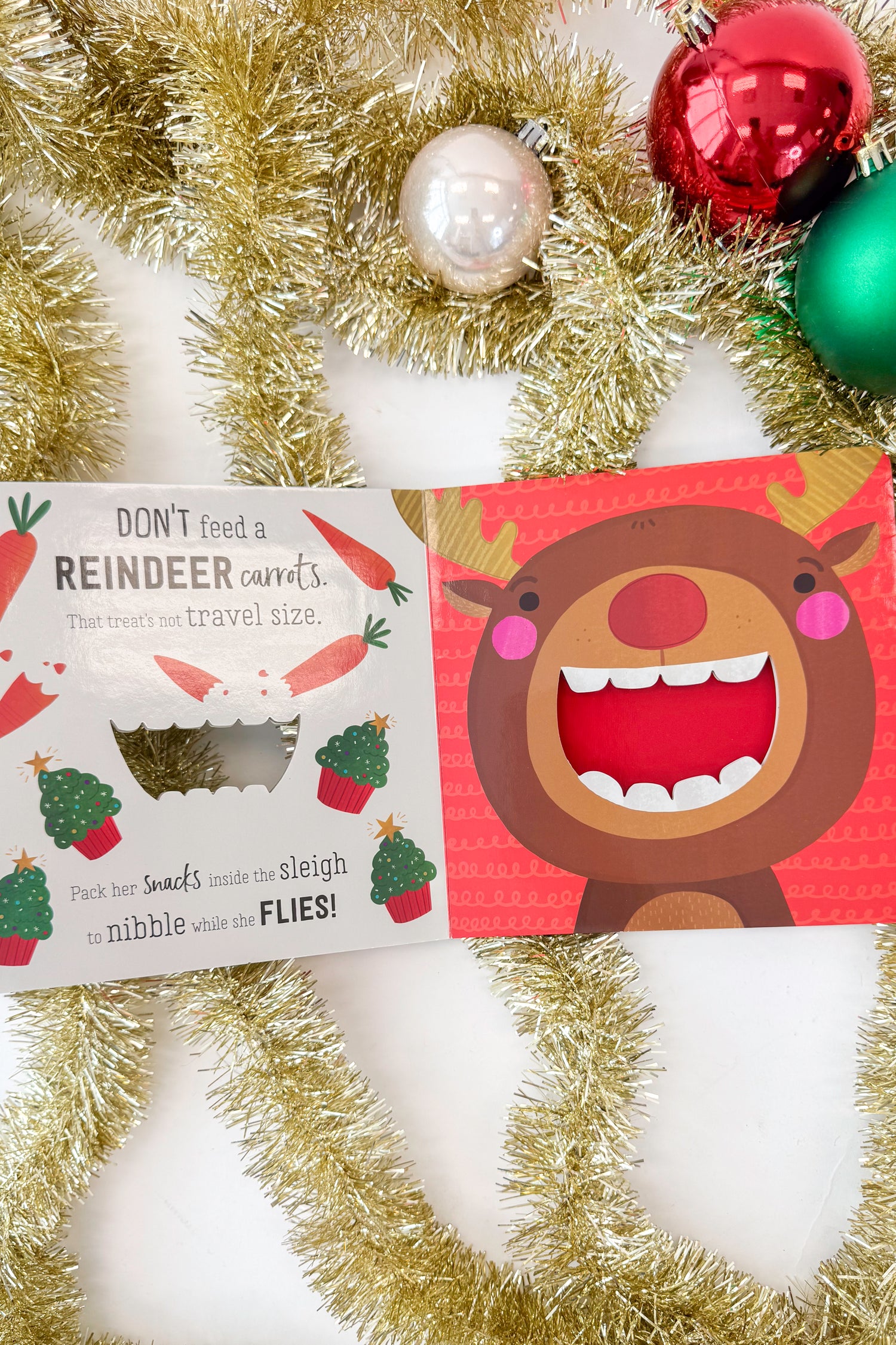 Book cover with a cartoon Reindeer face and text &