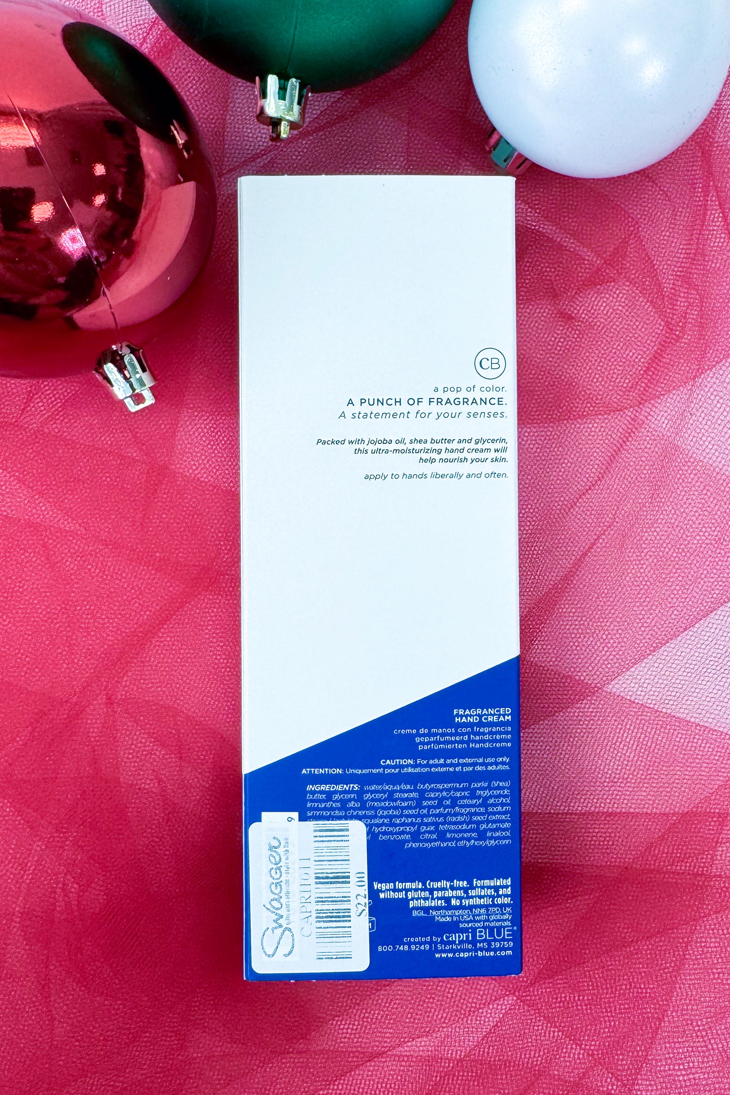 Capri Blue Volcano fragranced hand cream on a festive background