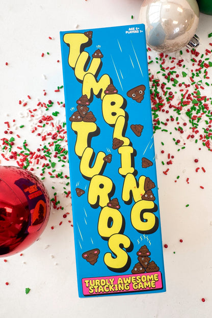 Box of Tumbling Turtles stacking game with blue background and yellow text