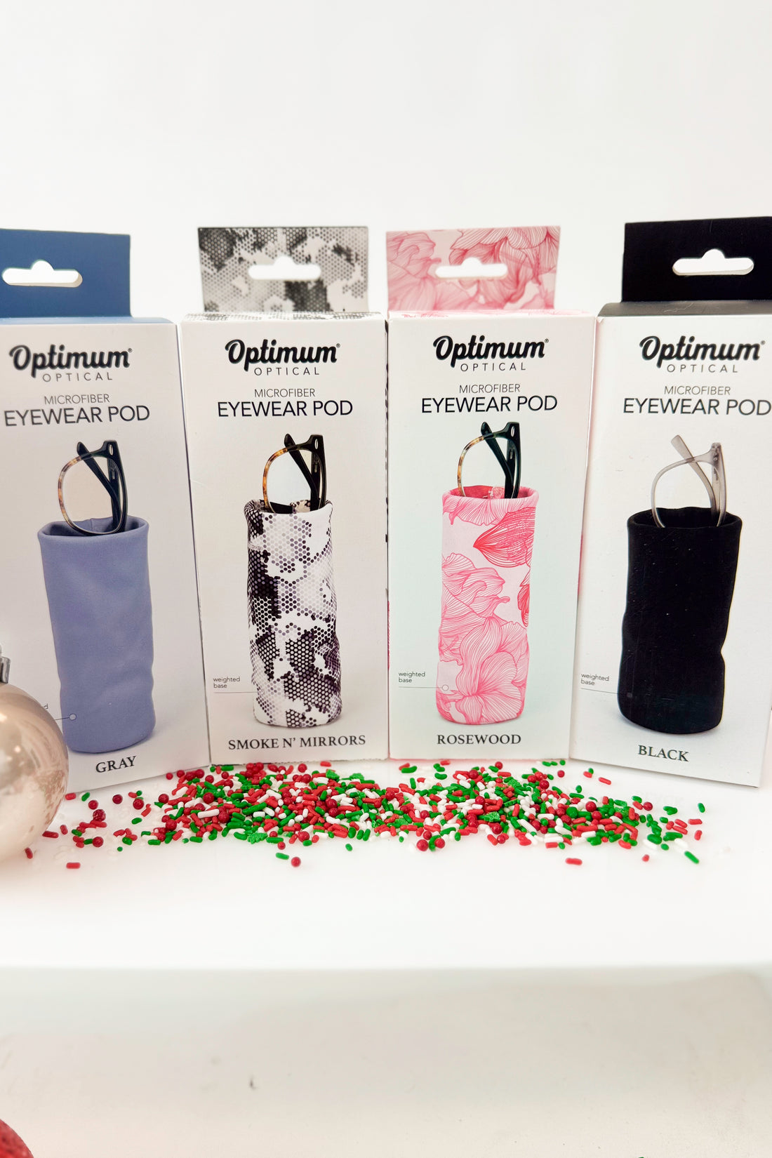 Eyeglass cases with a pair of glasses on a white background