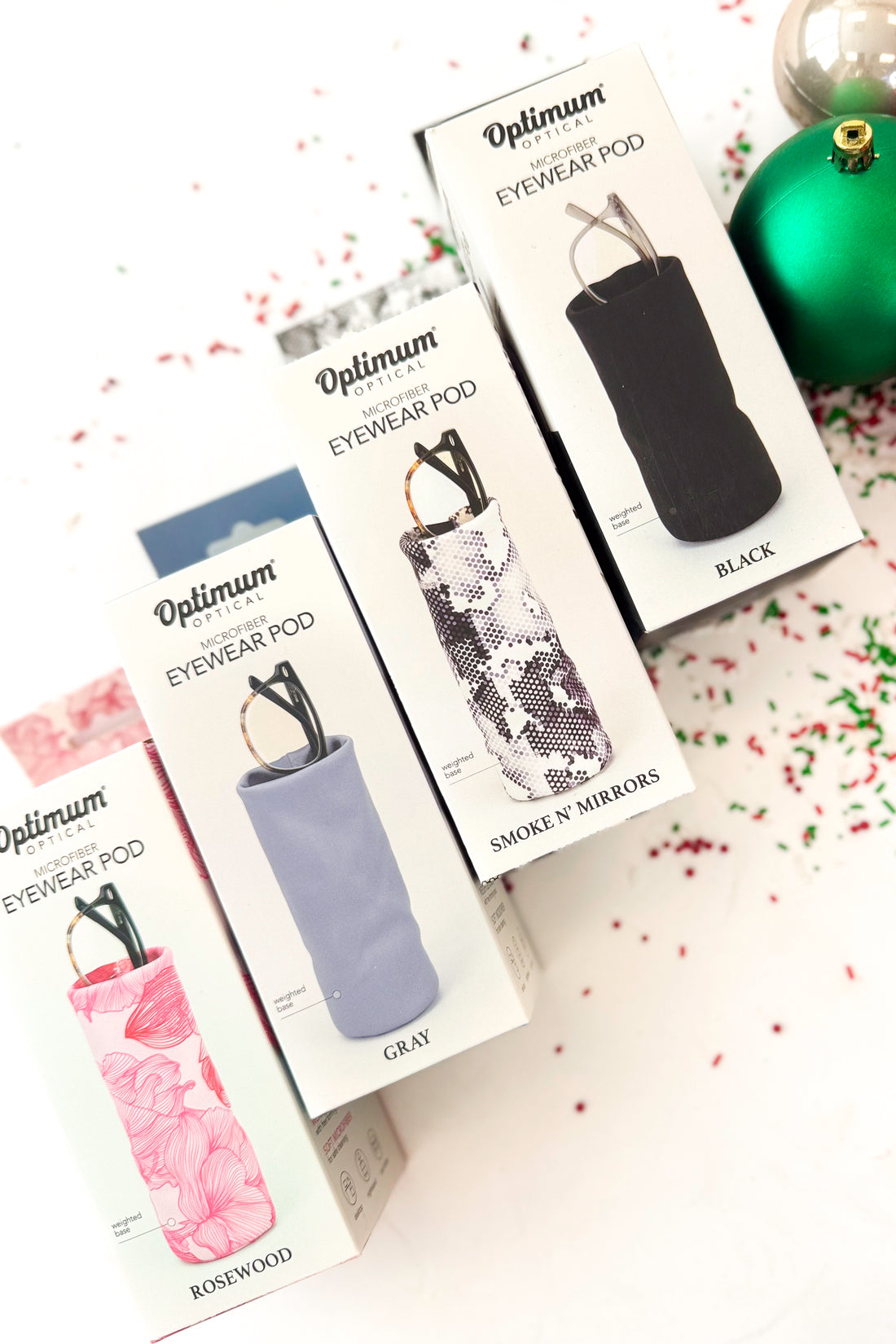 Eyeglass cases with a pair of glasses on a white background