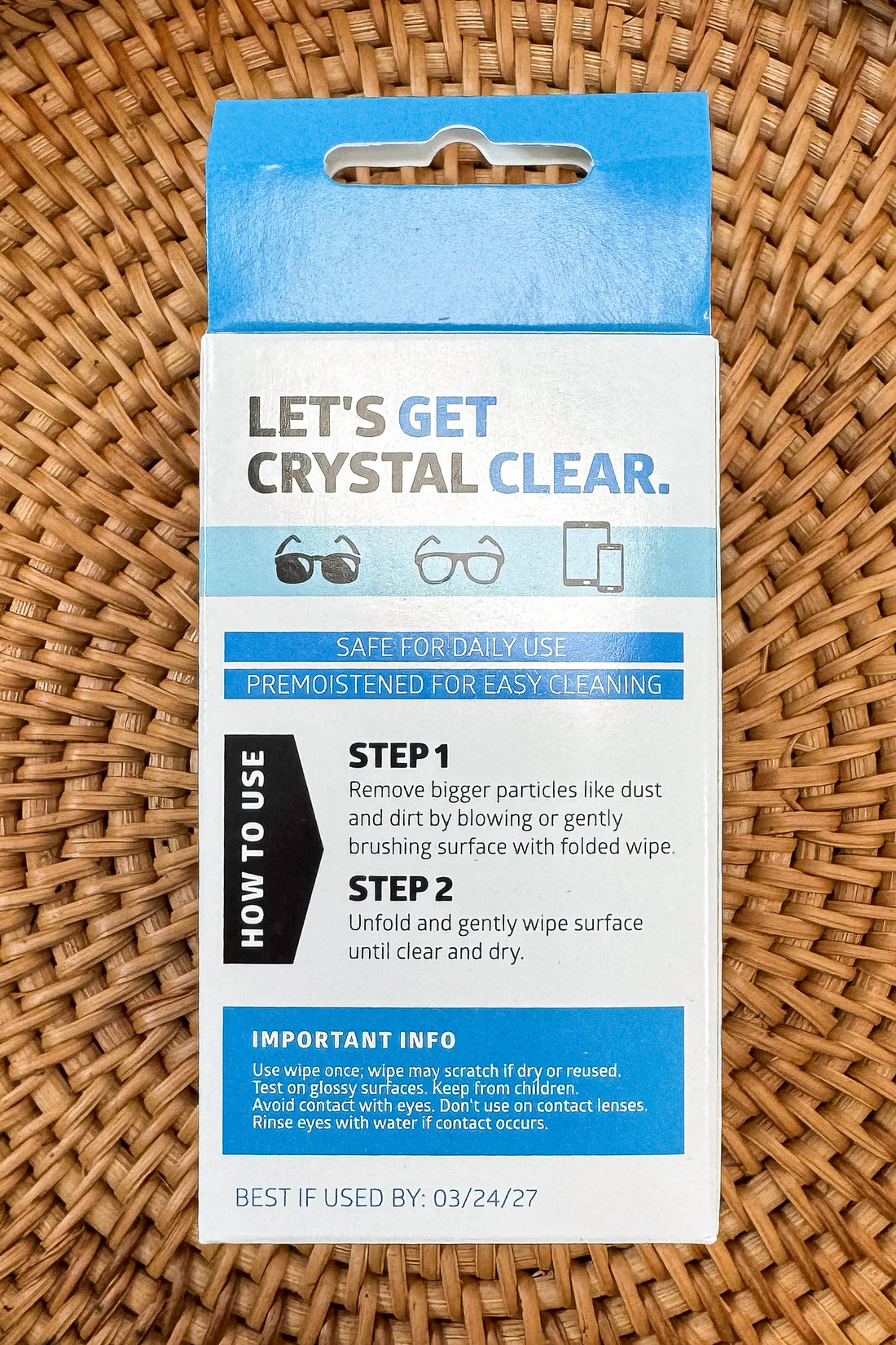 Pack of Optimum Optical disposable cleaning wipes on a patterned background
