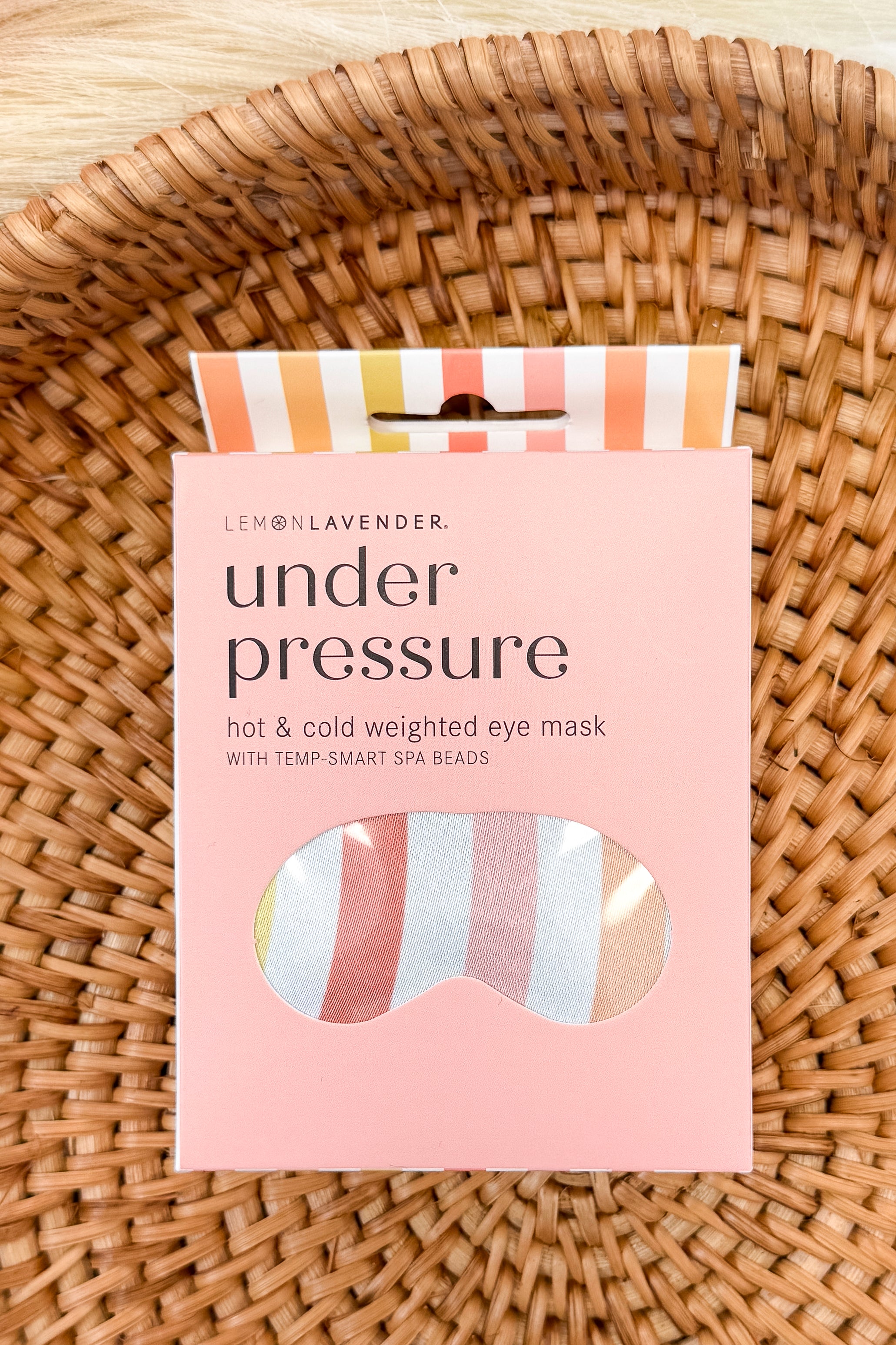 Under Pressure colorful striped eye mask on a pattern background