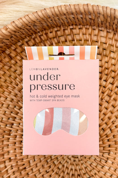 Under Pressure colorful striped eye mask on a pattern background