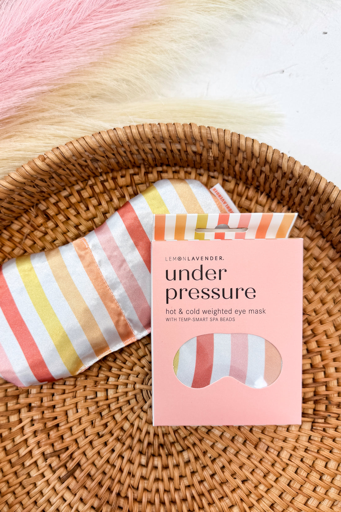 Under Pressure colorful striped eye mask on a pattern background