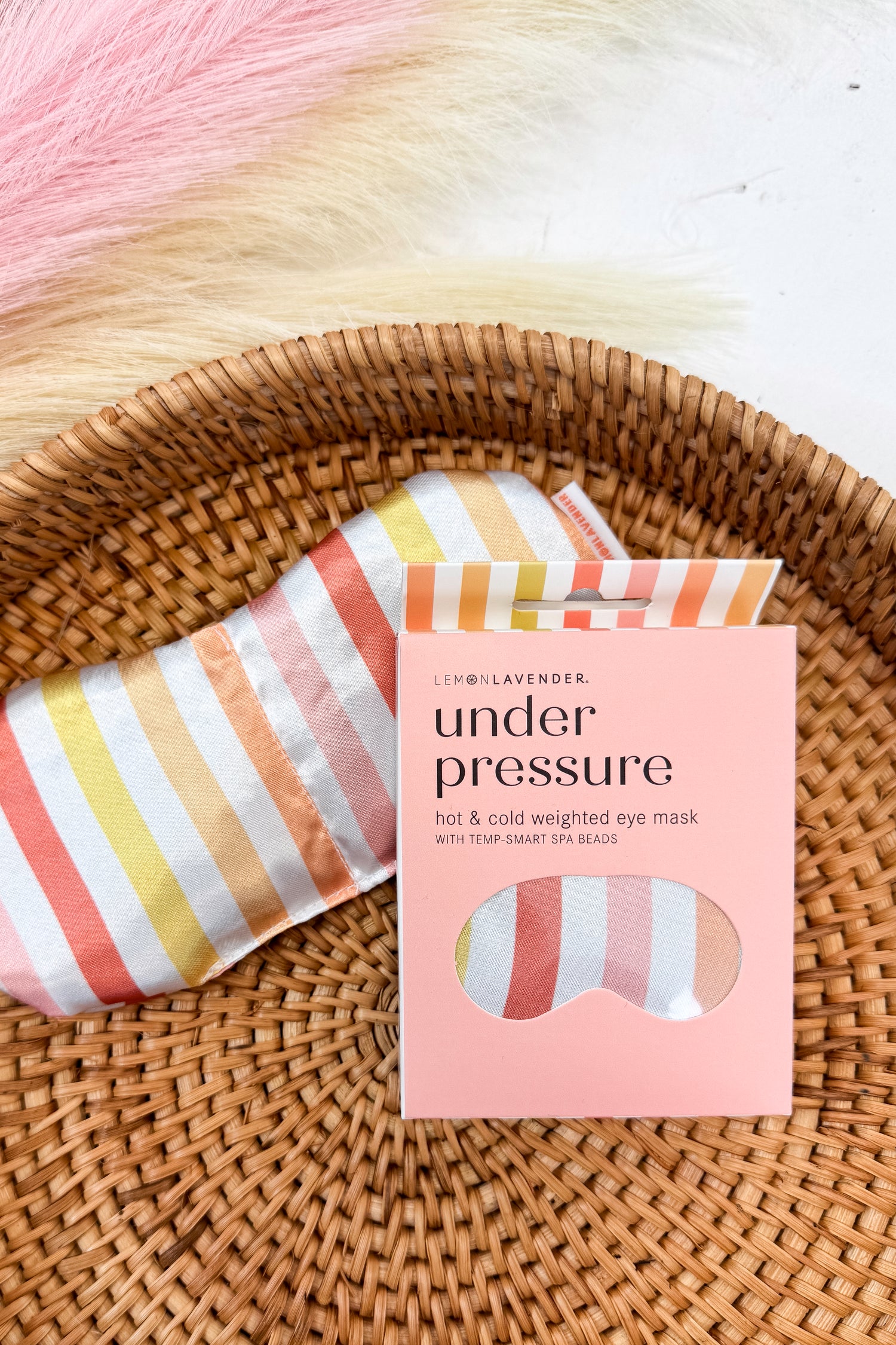 Under Pressure colorful striped eye mask on a pattern background