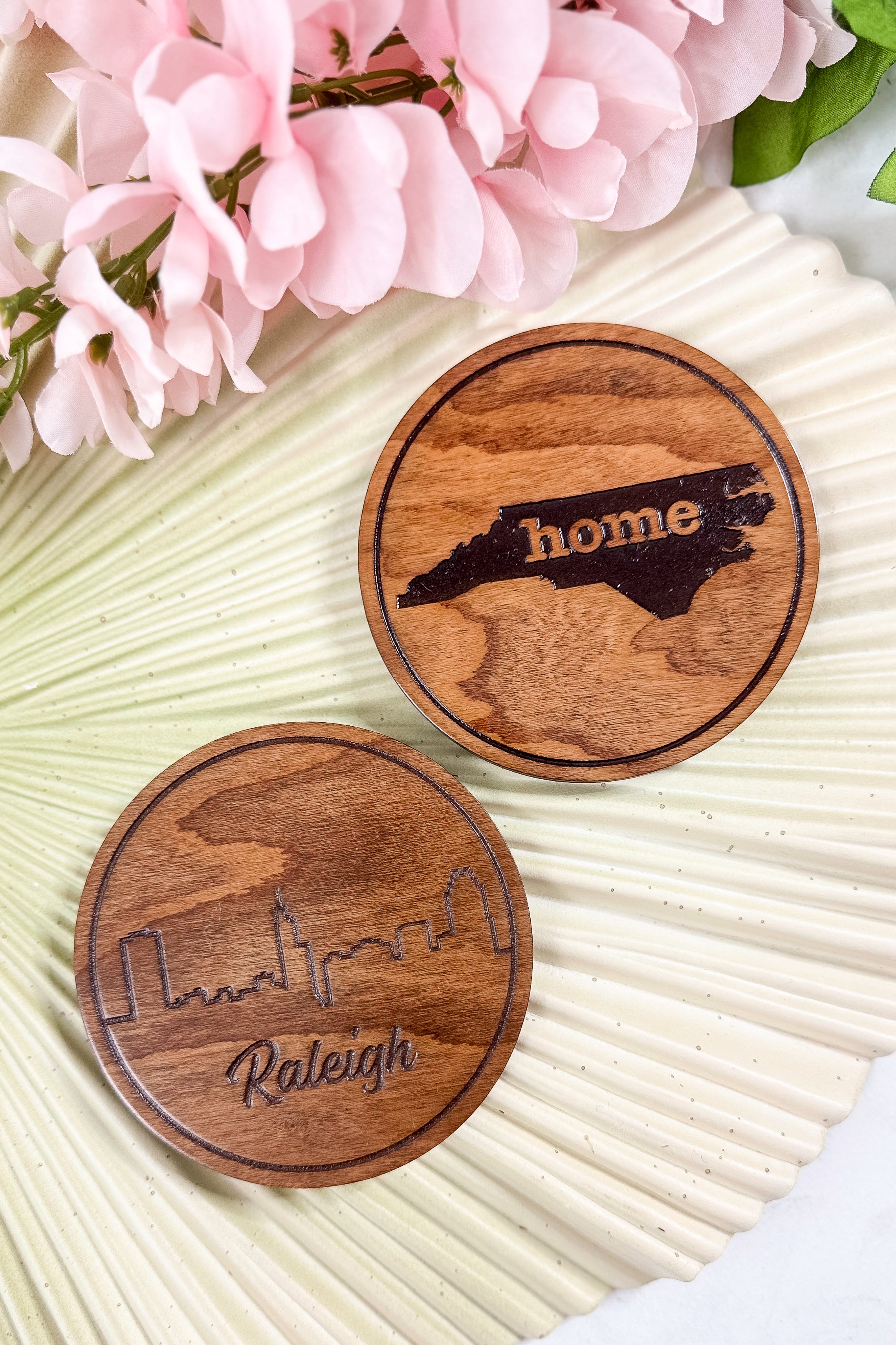 Wooden cutting board with a state outline and &