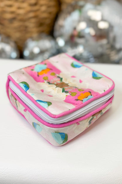 Small rectangular fabric case with colorful design on a white surface