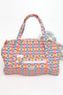 Multicolored patterned handbag with a visible brand label on a white background