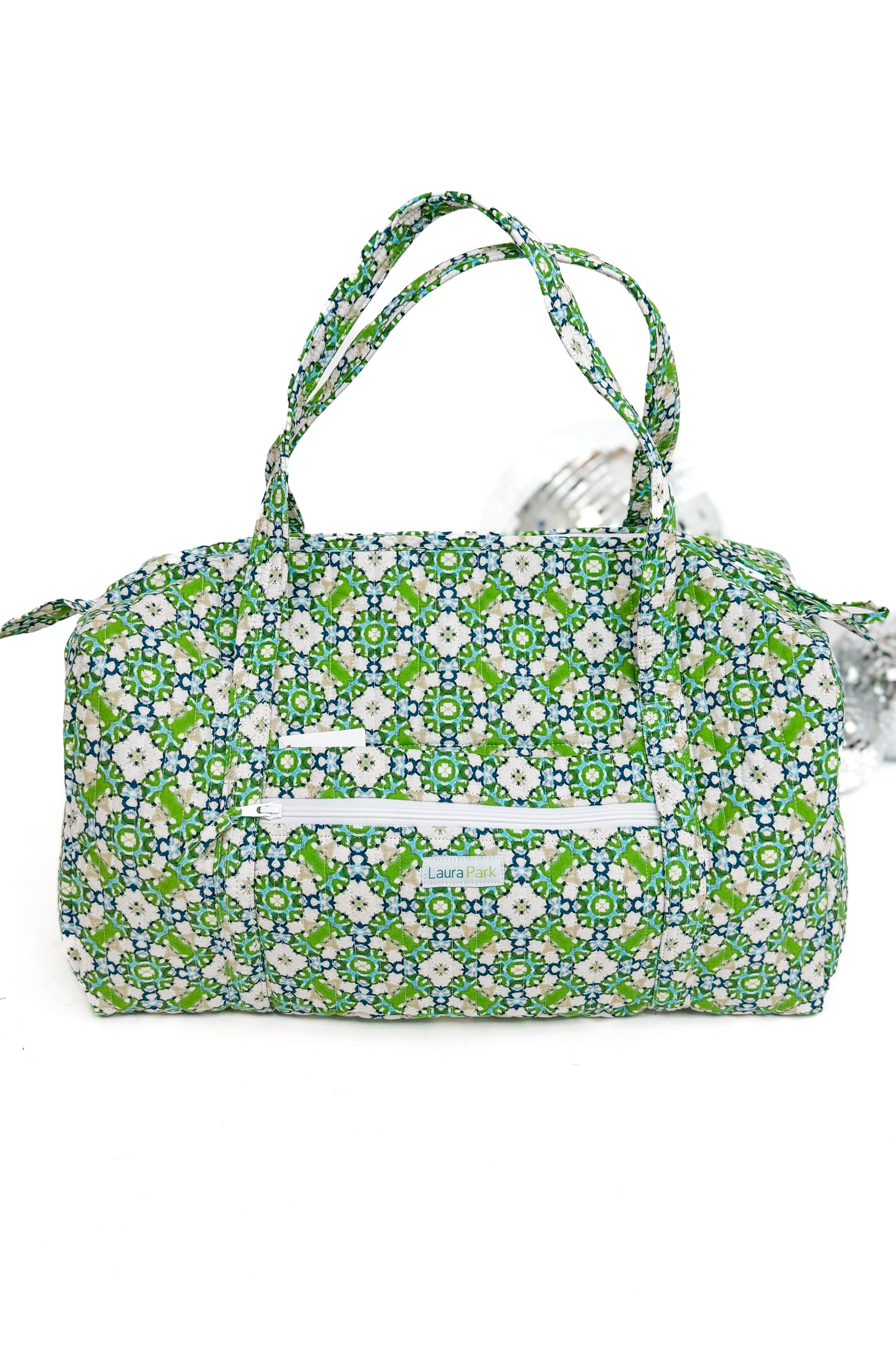 Floral patterned handbag on a white background