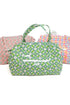 Floral patterned bag with two other bags in the background on a white background