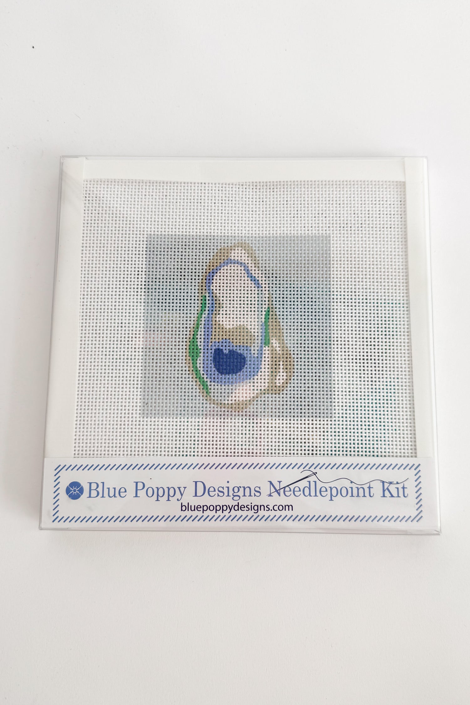 Blue Poppy Designs needlepoint kit on a white background