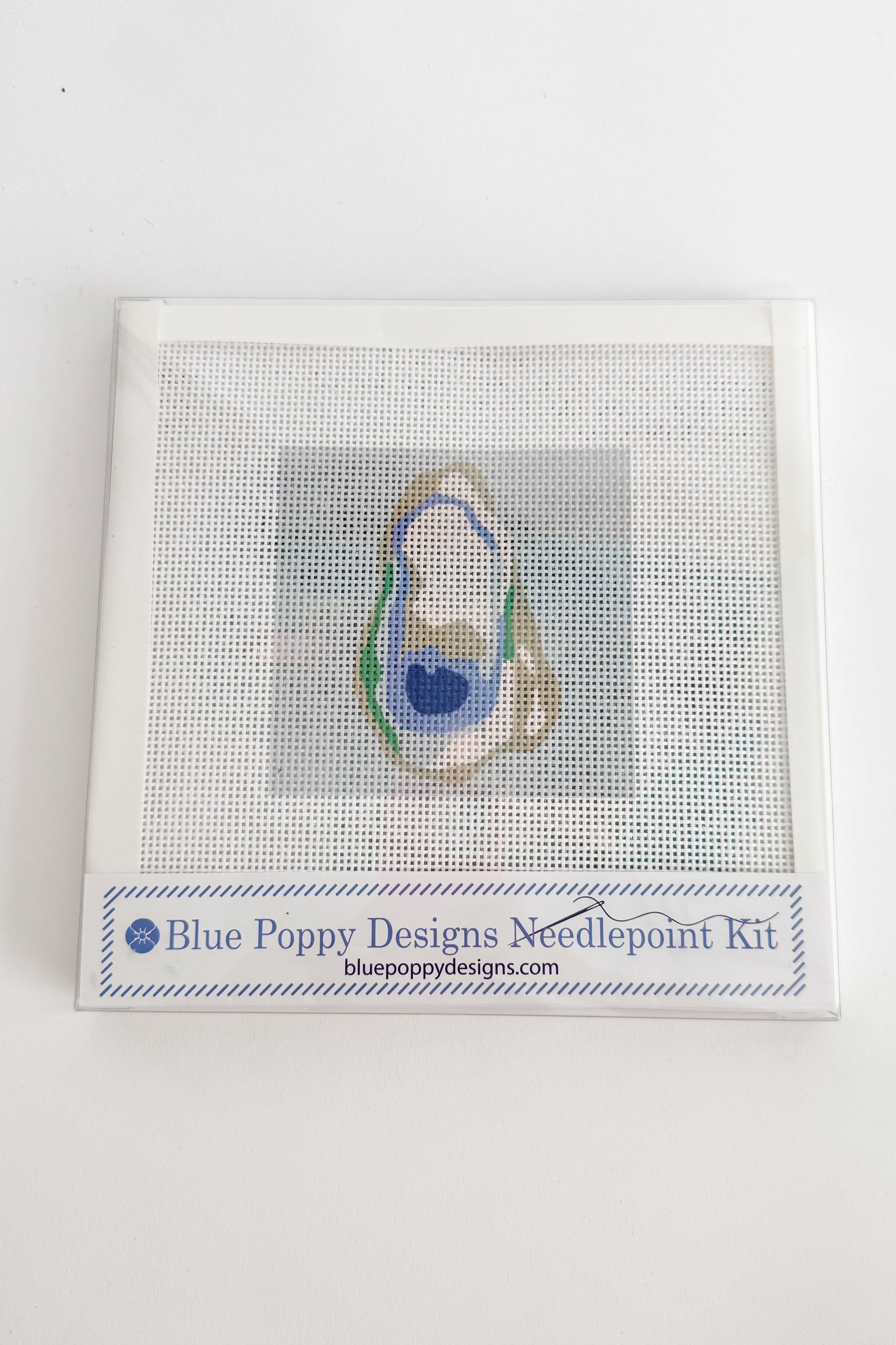 Blue Poppy Designs needlepoint kit on a white background