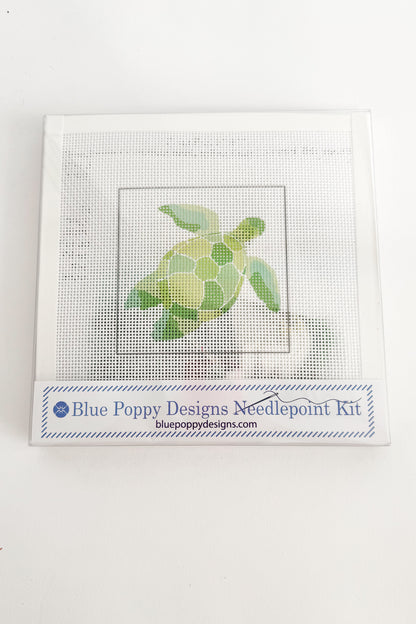 Cross-stitch kit with a turtle design and Blue Poppy Designs branding on a white background