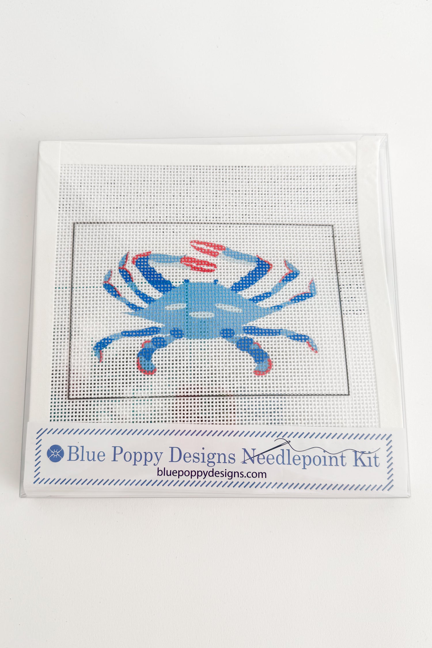 Blue crab needlepoint kit by Blue Poppy Designs on a white background