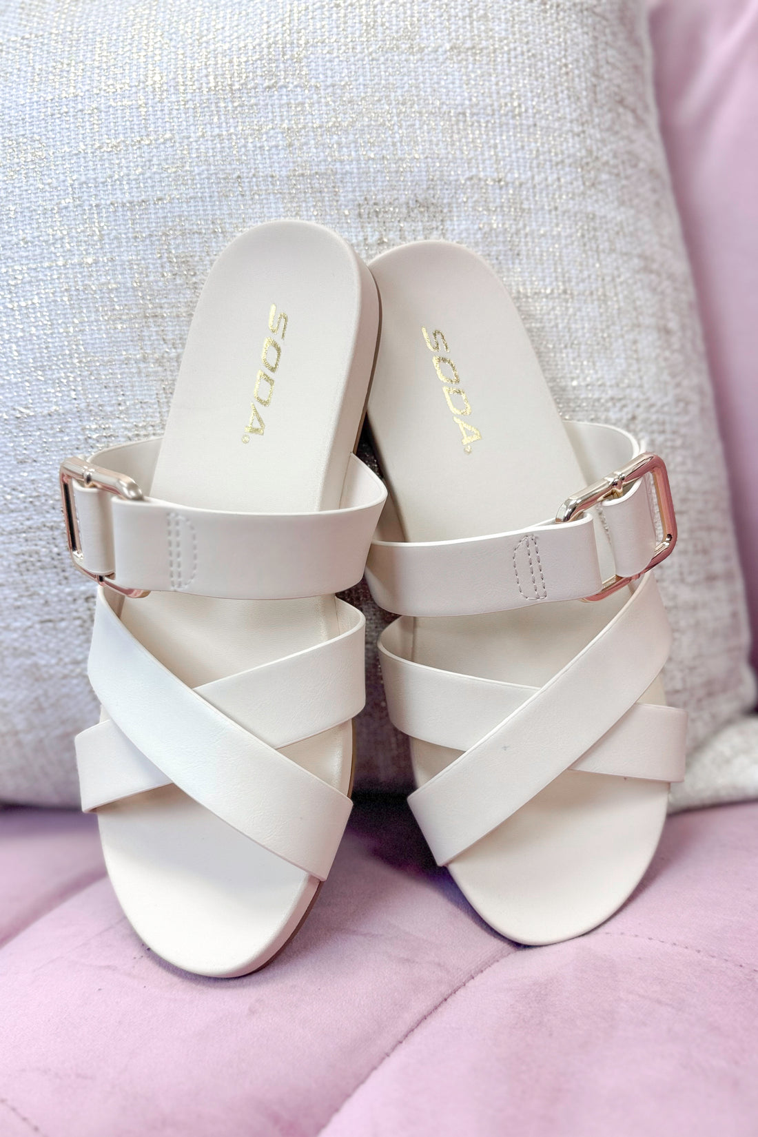 Terse- Bone Multi Strap Buckle Detail Sandal against pink and neutral background.