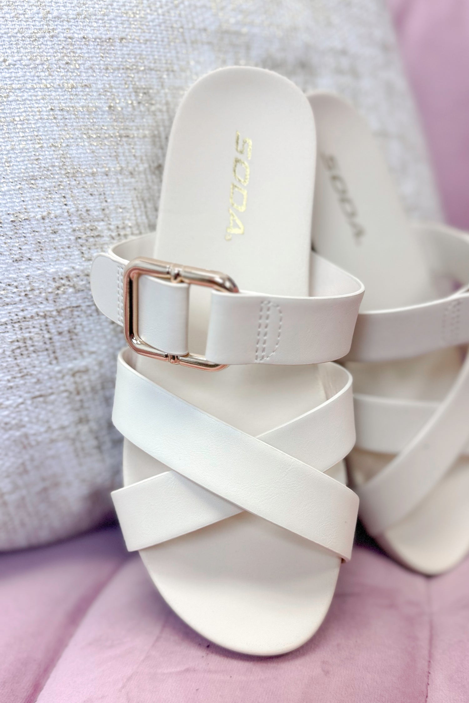 Terse- Bone Multi Strap Buckle Detail Sandal against pink and neutral background.