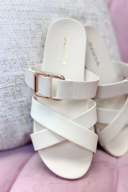 Terse- Bone Multi Strap Buckle Detail Sandal against pink and neutral background.