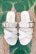 Terse- Bone Multi Strap Buckle Detail Sandal against beachy background.