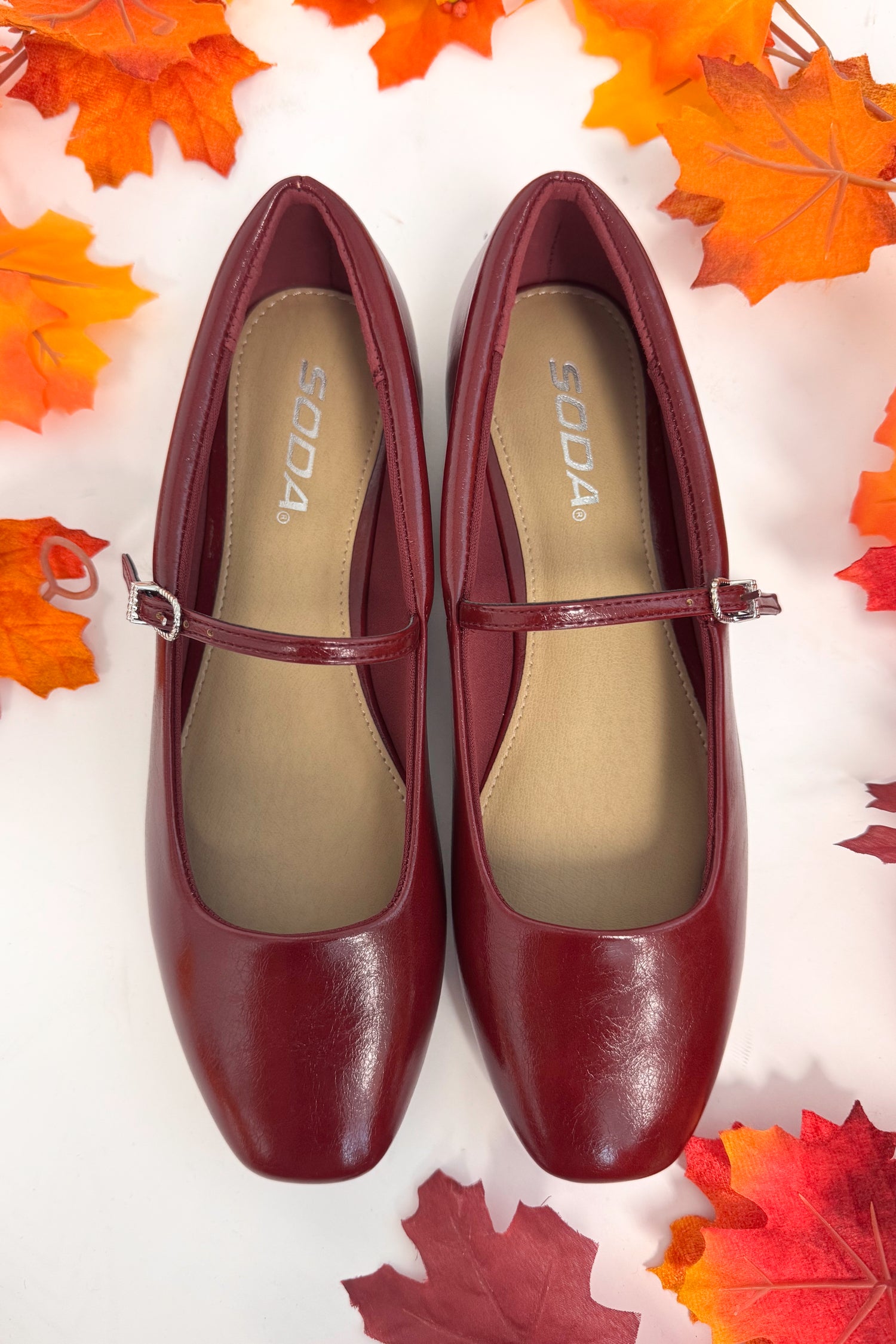 Pair of brown shoes with &