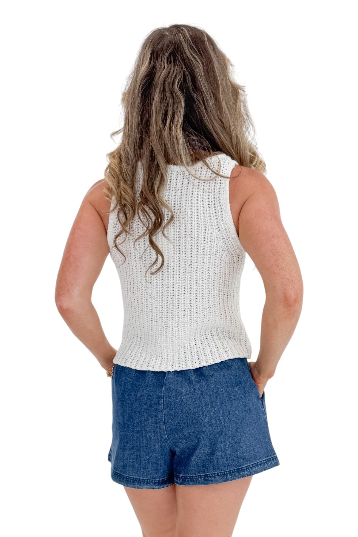 Back view of woman wearing Swagger Boutique’s Indigo Denim Shorts With Elastic Waist with top against white studio background.