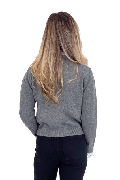 Person wearing a gray sweater from behind on a white background