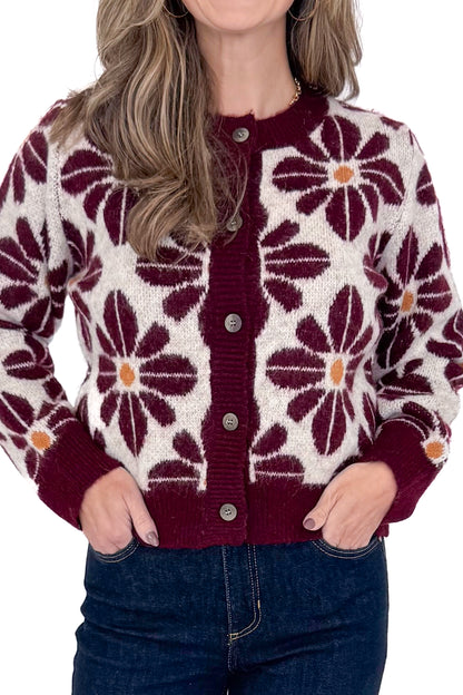 Front detailed view of woman wearing Wine Floral Printed Button Up Cardigan by Entro with jeans against white studio background.