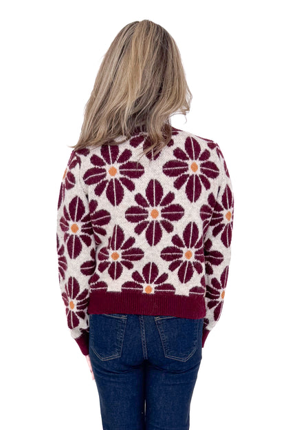 Back view of woman wearing Wine Floral Printed Button Up Cardigan by Entro with jeans against white studio background.