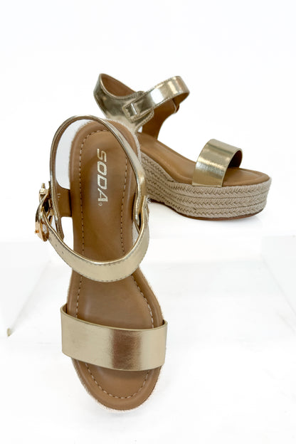 Jena Gold and Rattan Wedge shoes against white studio background.