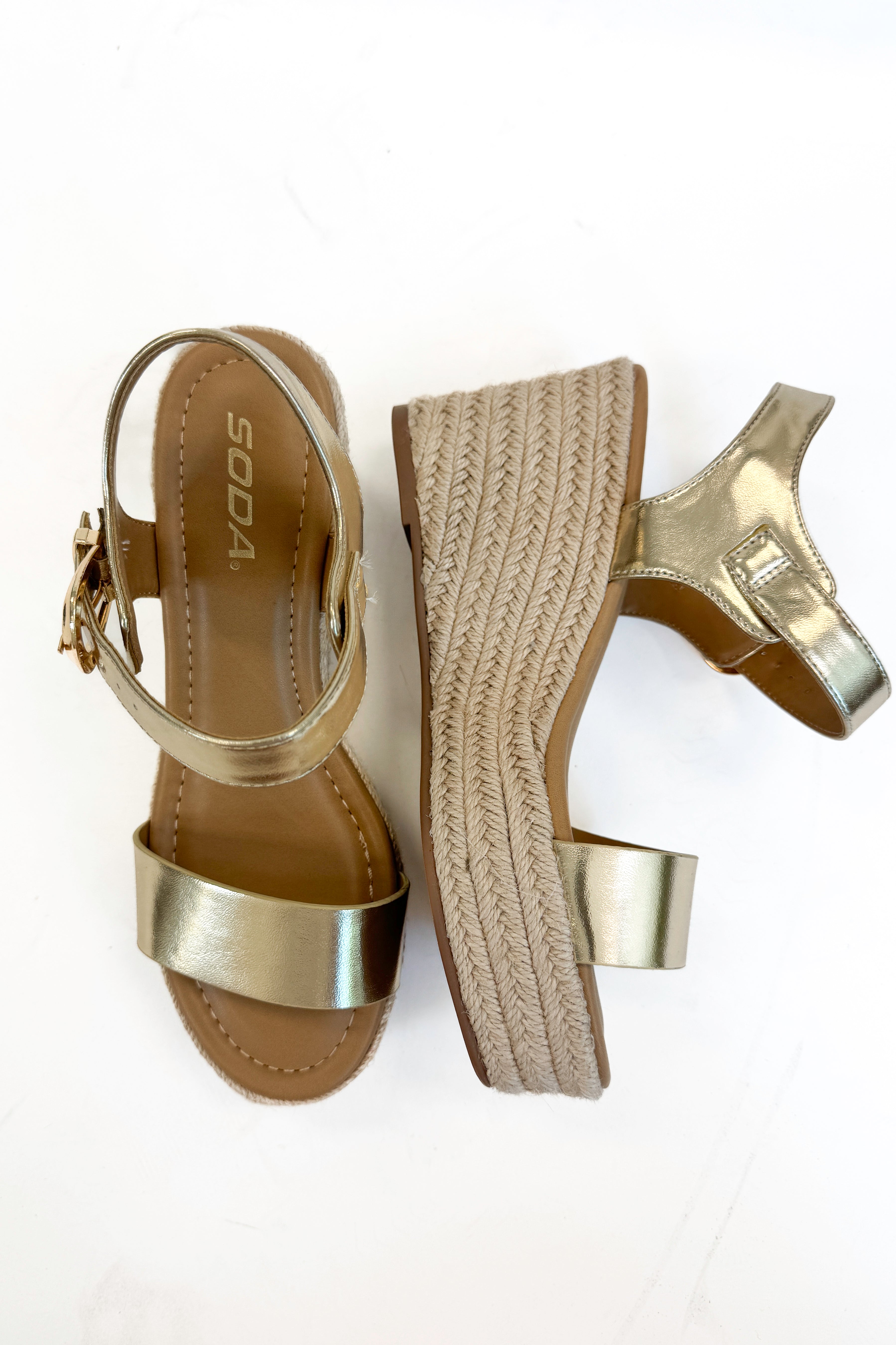 Jena Gold and Rattan Wedge shoes against white studio background.