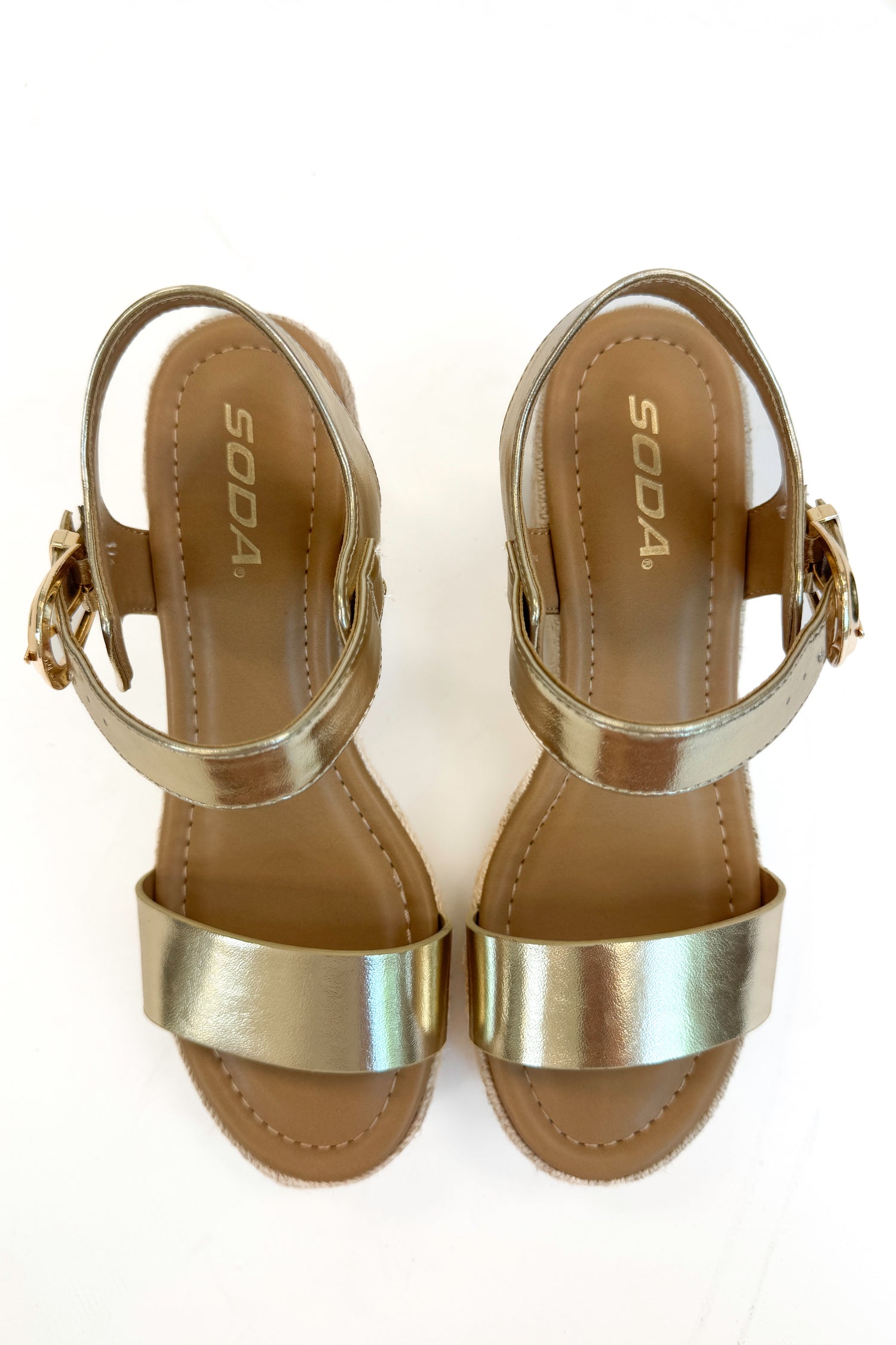 Jena Gold and Rattan Wedge shoes against white studio background.