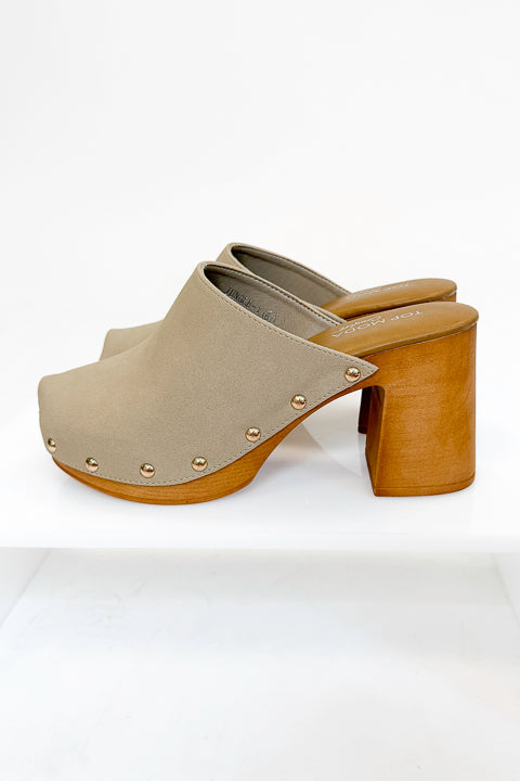 Jungle- Beige Studded Clogs against studio background side view