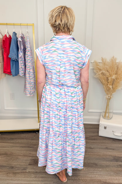 Back view of woman wearing Just A Little Something Pink &amp; Blue Abstract Print Skirt with matching top at Swagger boutique.
