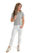 Front view of woman wearing top with Kelsey Optic White Ankle Flare Jeans by Kut from the Kloth against white studio background.