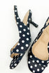 Keep- Black & White Polka Dot Kitten Heels against white studio background.