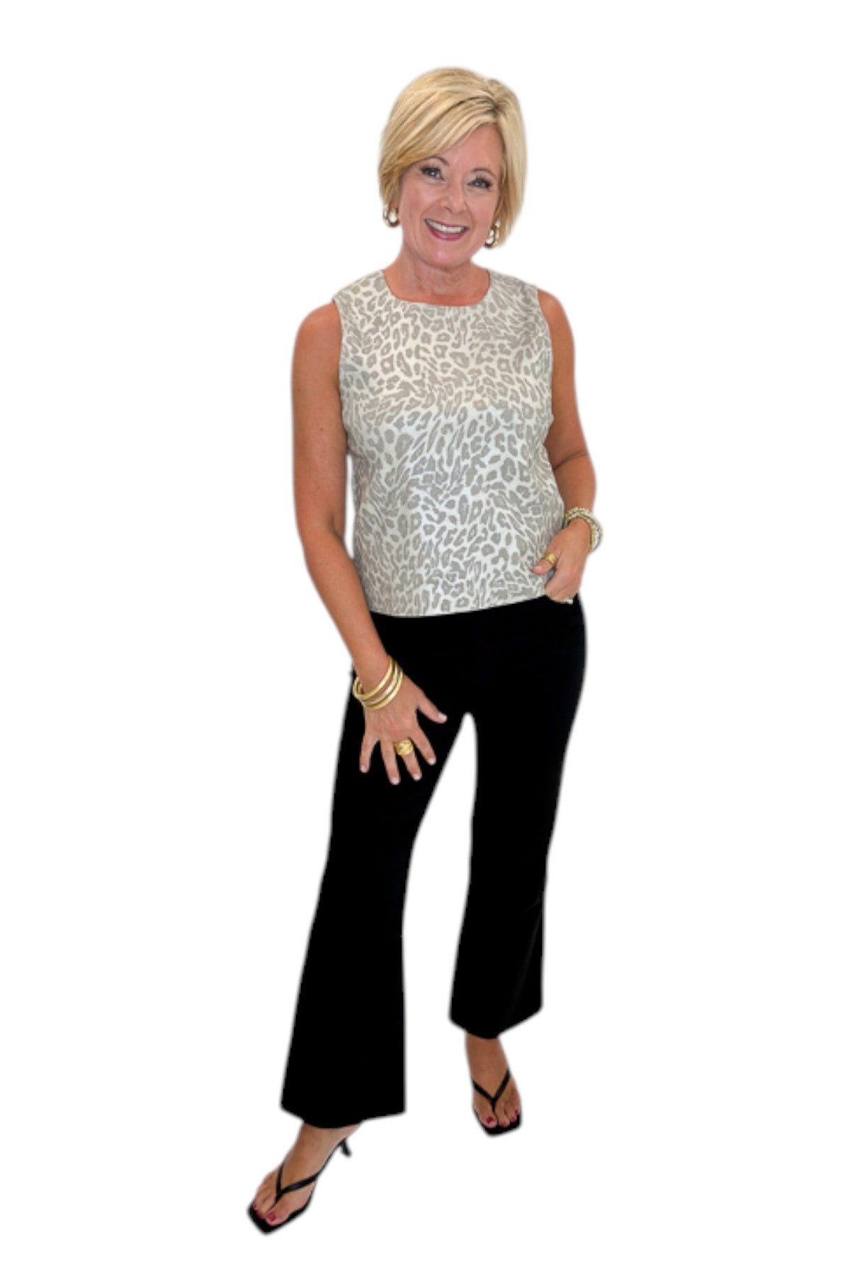 Front view of woman wearing Swagger Boutique’s Kelsey Ankle Flare Jeans In Black by Kut from the Kloth with top against white studio background.