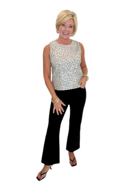 Front view of woman wearing Swagger Boutique’s Kelsey Ankle Flare Jeans In Black by Kut from the Kloth with top against white studio background.