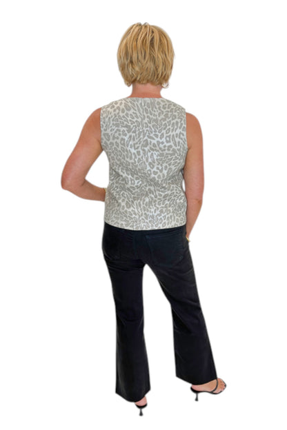 Back view of woman wearing Swagger Boutique’s Kelsey Ankle Flare Jeans In Black by Kut from the Kloth with top against white studio background.
