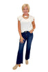 Front view of woman wearing Swagger Boutique’s Kelsey Ankle Flare Jeans In Dark Wash- Improve by Kut from the Kloth with top against white studio background.