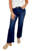 Front view of woman wearing Swagger Boutique’s Kelsey Ankle Flare Jeans In Dark Wash- Improve by Kut from the Kloth with top against white studio background.